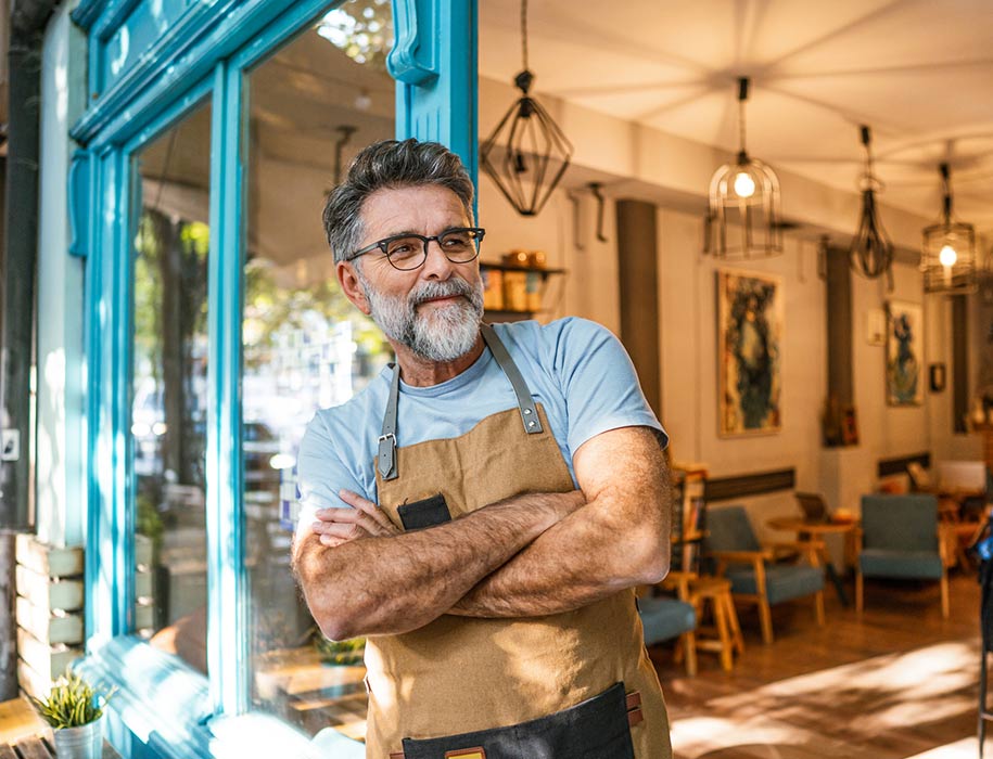 Small business person in doorway.