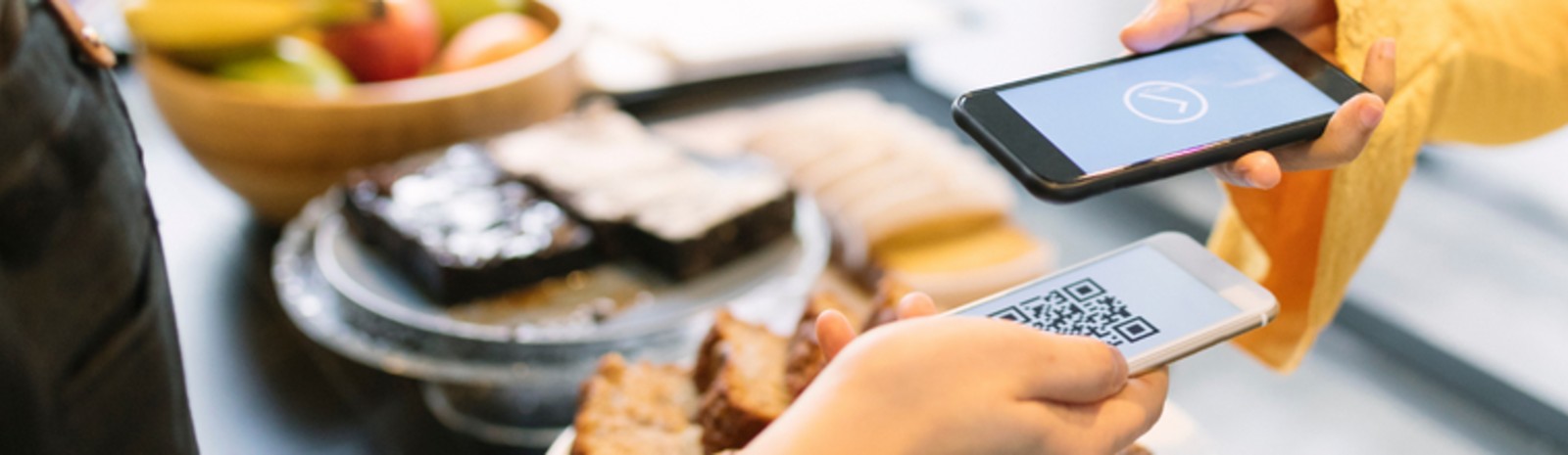 Person paying with their phone.