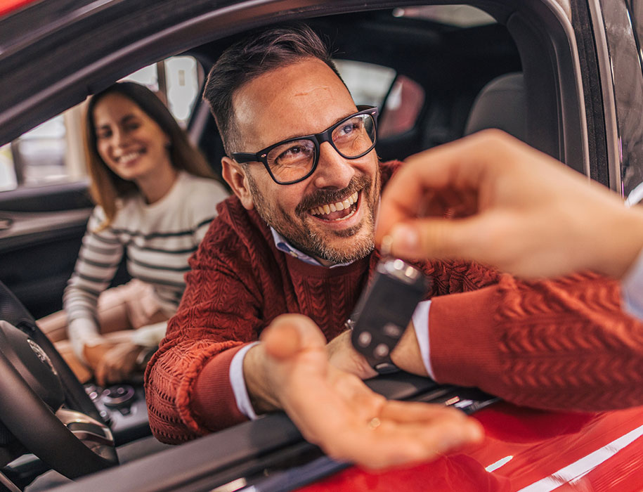 Couple purchasing a new car.
